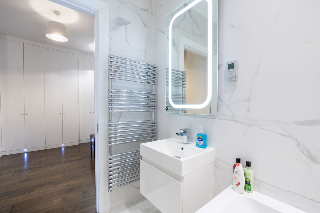 Bathroom vanity and heated towel rail in the three bedroom Reading apartment