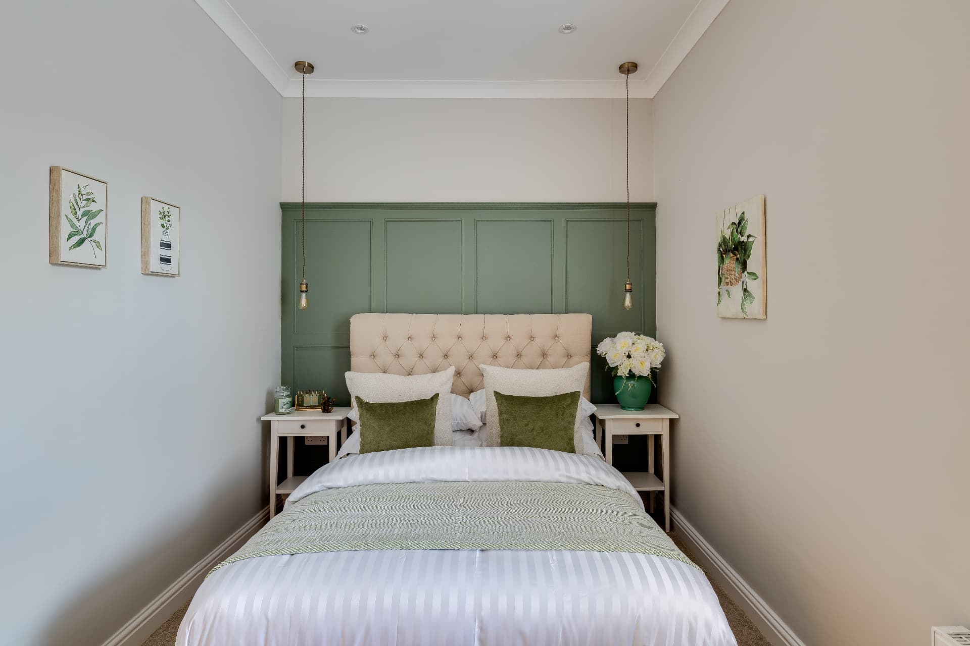 Front bedroom with green feature wall in the two bedroom Chester property