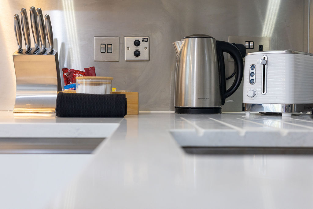 Kitchen countertop and appliances in the three bedroom Reading apartment