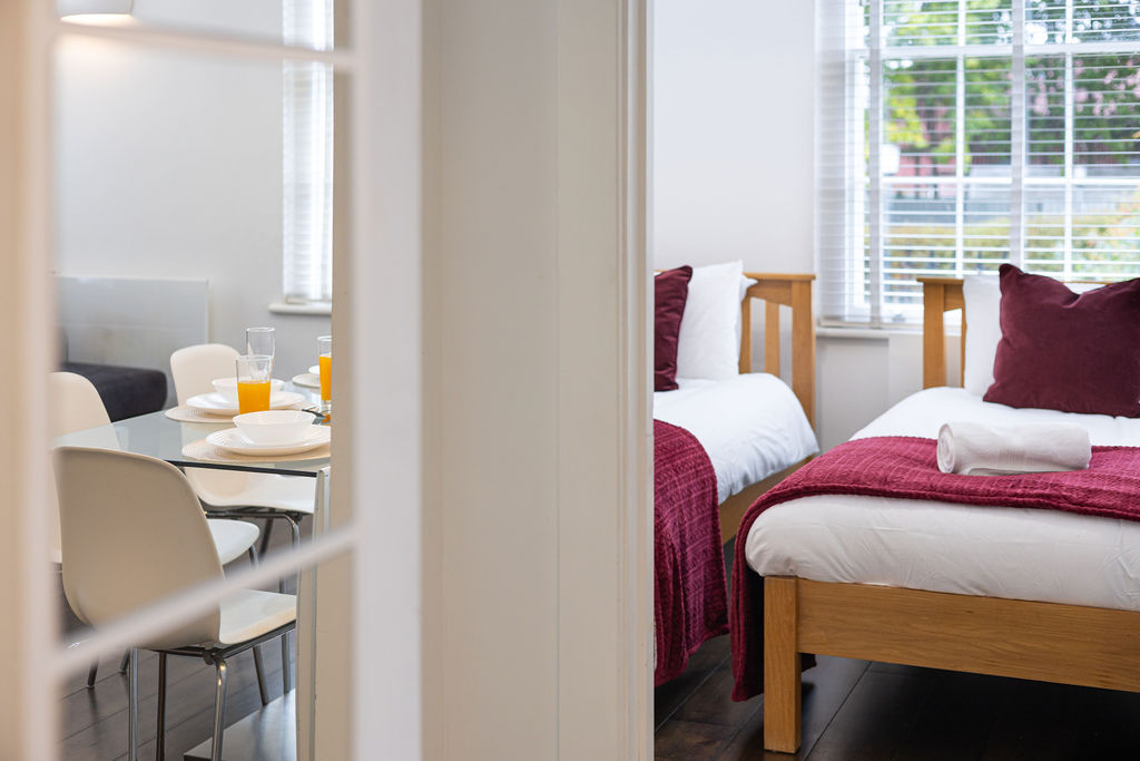 Twin bedroom beside the dining area in the three bedroom Reading apartment