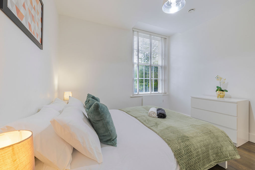 Main bedroom beside the window in the three bedroom Reading apartment