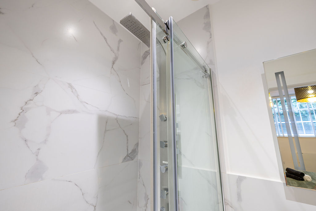 Walk-in shower detail in the two bedroom Reading apartment