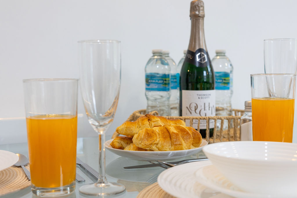 Breakfast table with croissants in the three bedroom Reading apartment