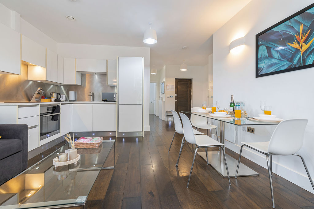 Open-plan kitchen, dining and living area in the three bedroom Reading apartment
