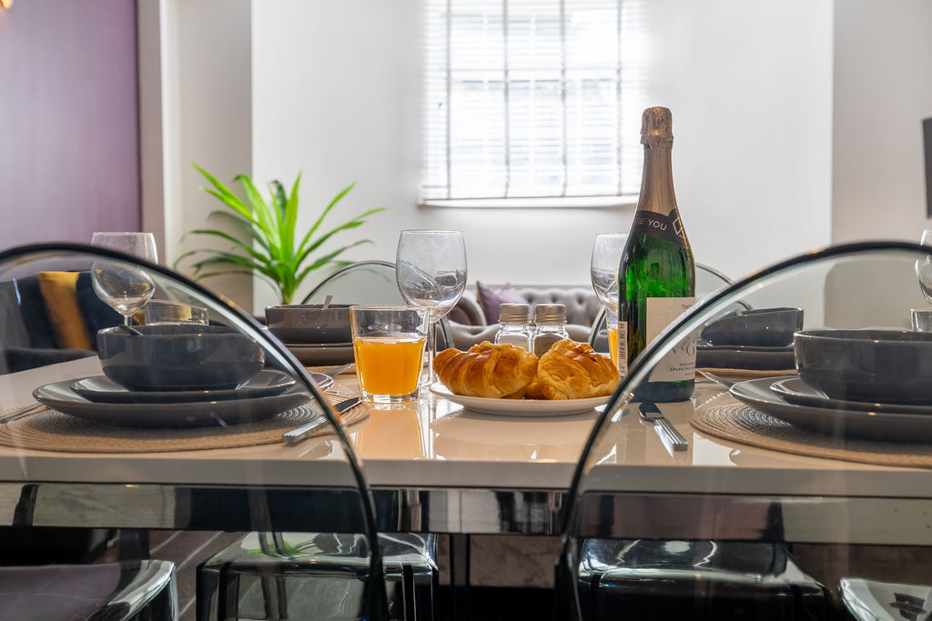 Dining table set for breakfast in the two bedroom Reading apartment