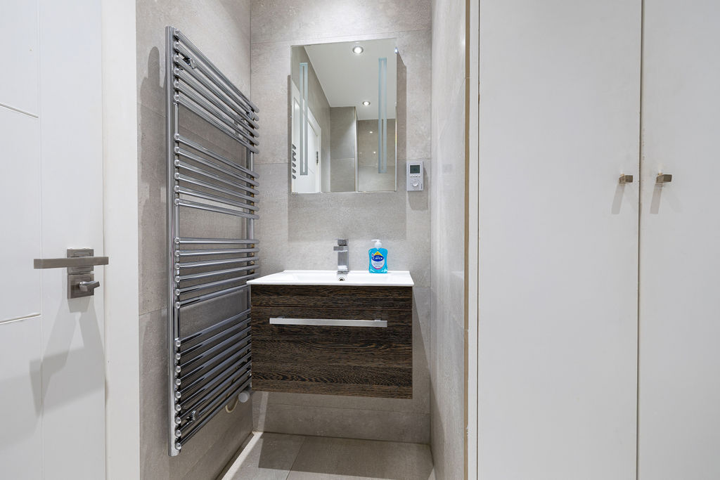 Bathroom vanity and towel rail in the two bedroom Reading apartment