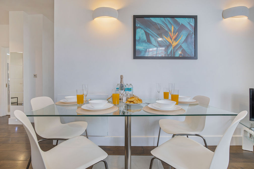 Dining table set for breakfast in the three bedroom Reading apartment